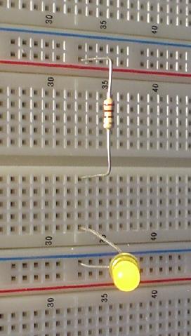 LED lighting up, driven through a resistor