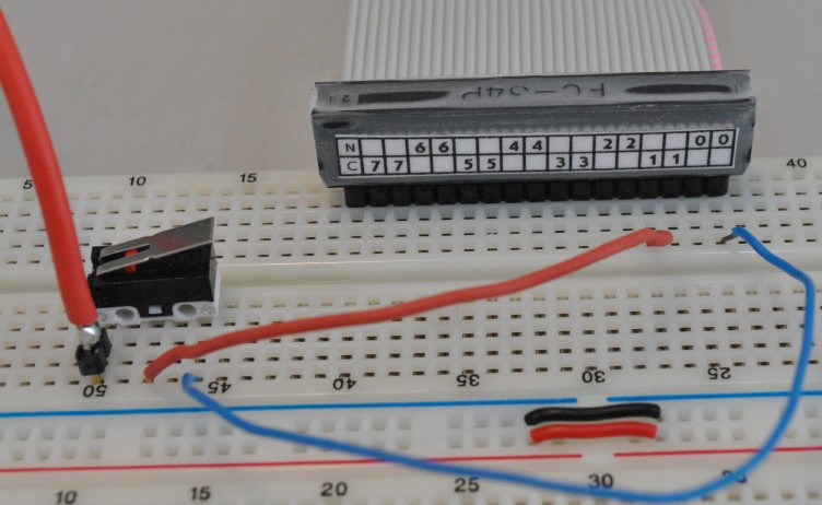 Detail of ribbon cable end attaching to breadboard (photo)